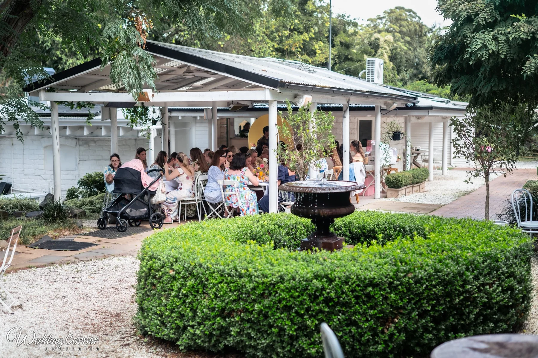 Guests seated in the courtyard at The Hills Grove Kenthurst